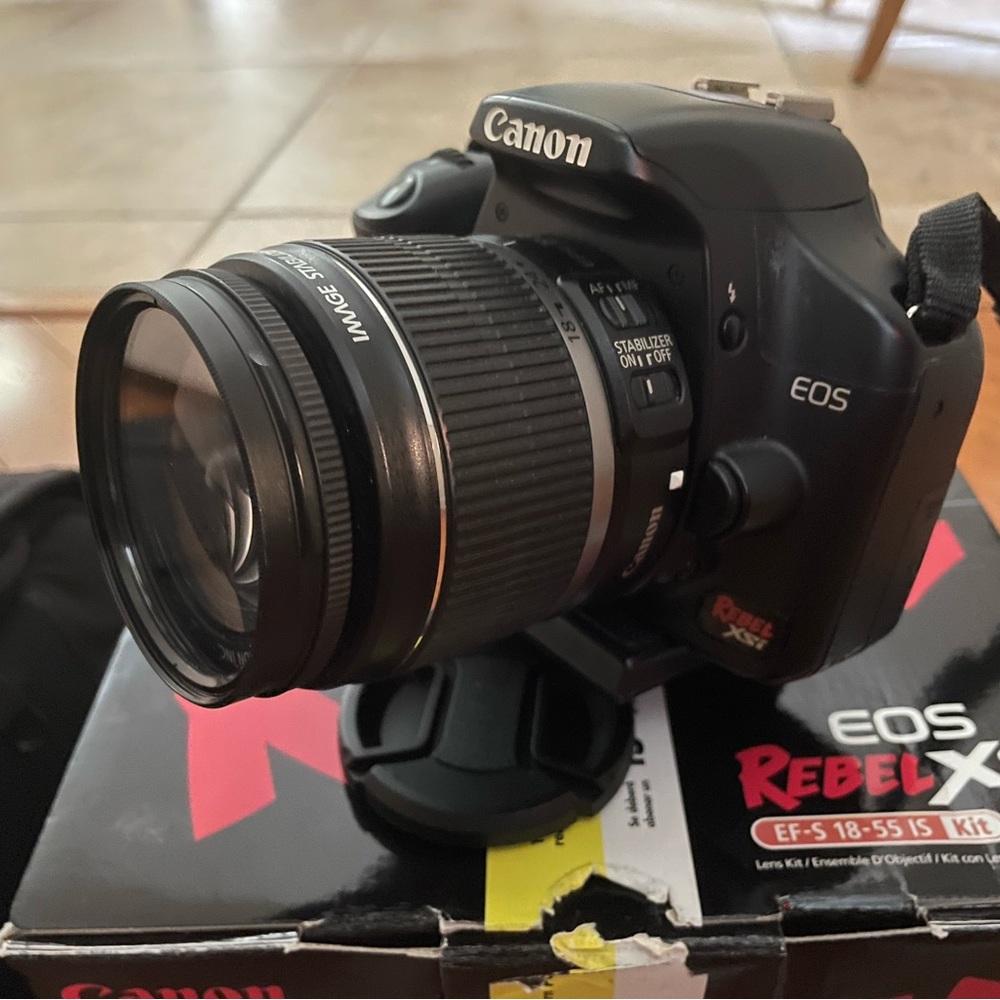 Canon Rebel Xsi DSLR camera with EF-S 18-55mm lens.